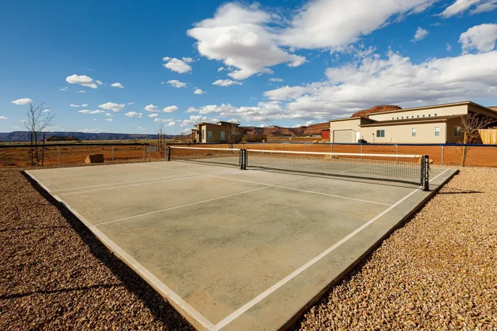 View of tennis court with a mountain view