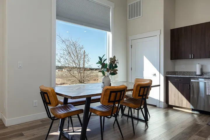 Dining space with dark wood-style floors