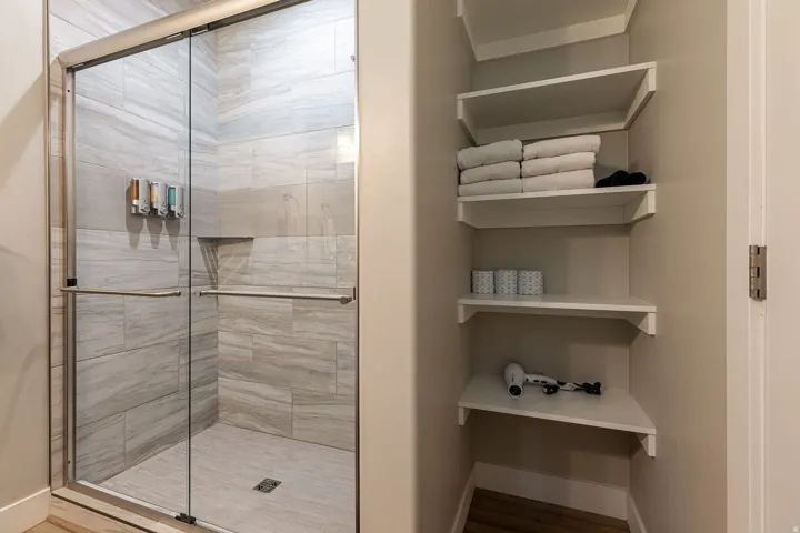 Bathroom with a stall shower and wood finished floors