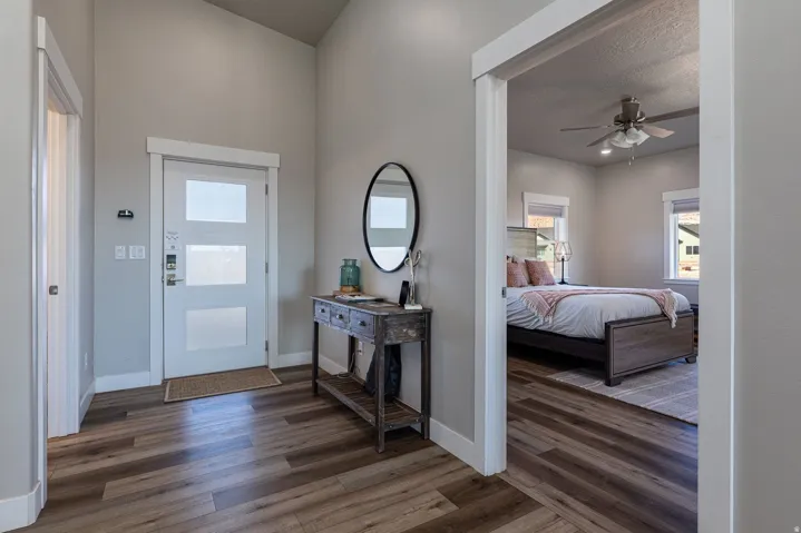 Entryway featuring dark wood-style floors and ceiling fan