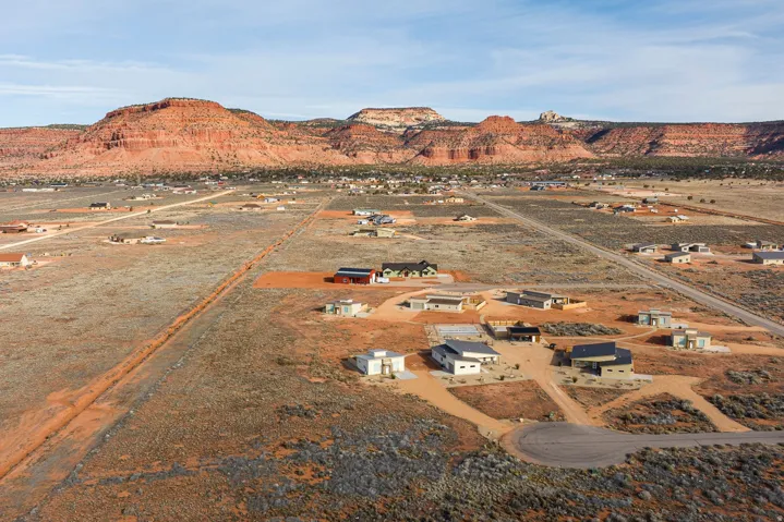 Aerial view of property and surrounding area with a desert landscape and rural landscape