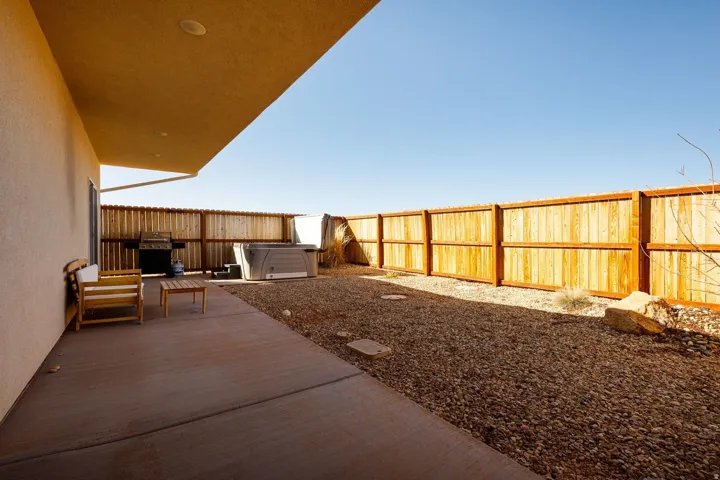 Fenced backyard featuring a wooden deck