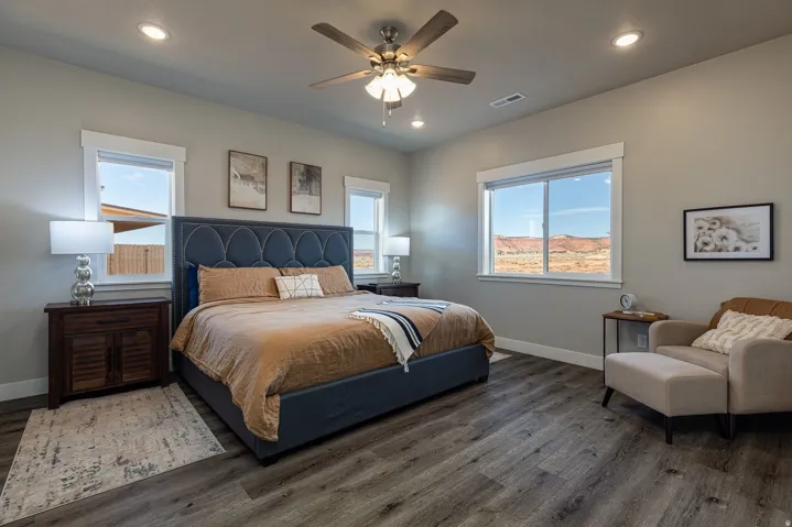 Bedroom with ceiling fan, wood finished floors, recessed lighting, and multiple windows