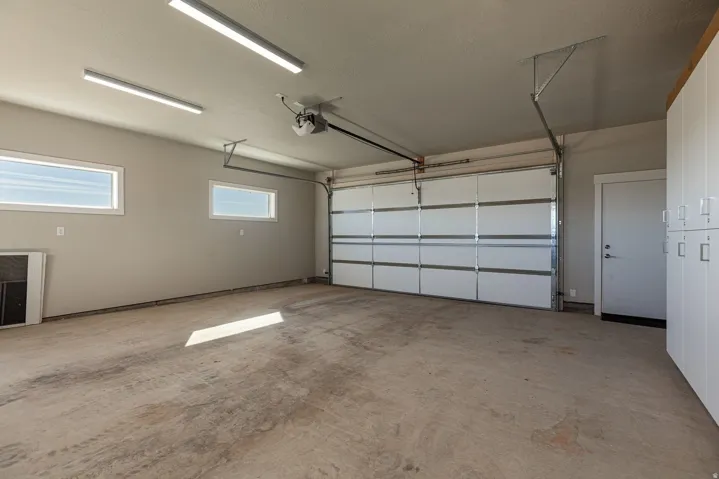 Garage featuring a garage door opener