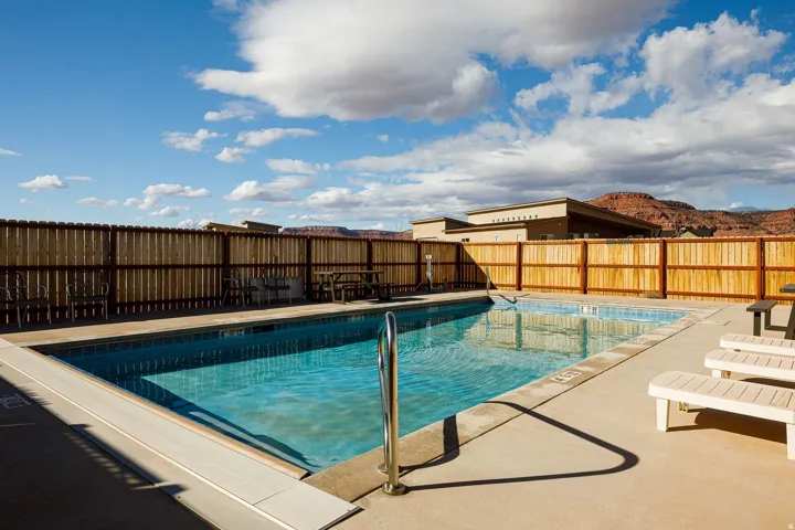 Community pool with a patio area