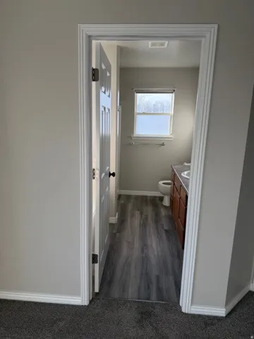 Bathroom with vanity and dark wood finished floors