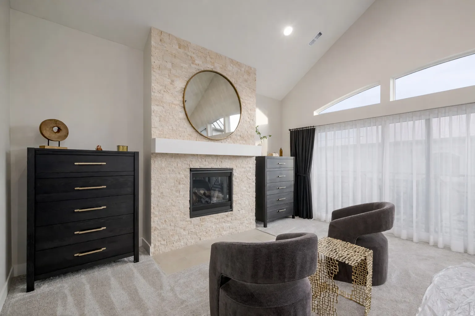 Primary suite sitting area with gas fireplace