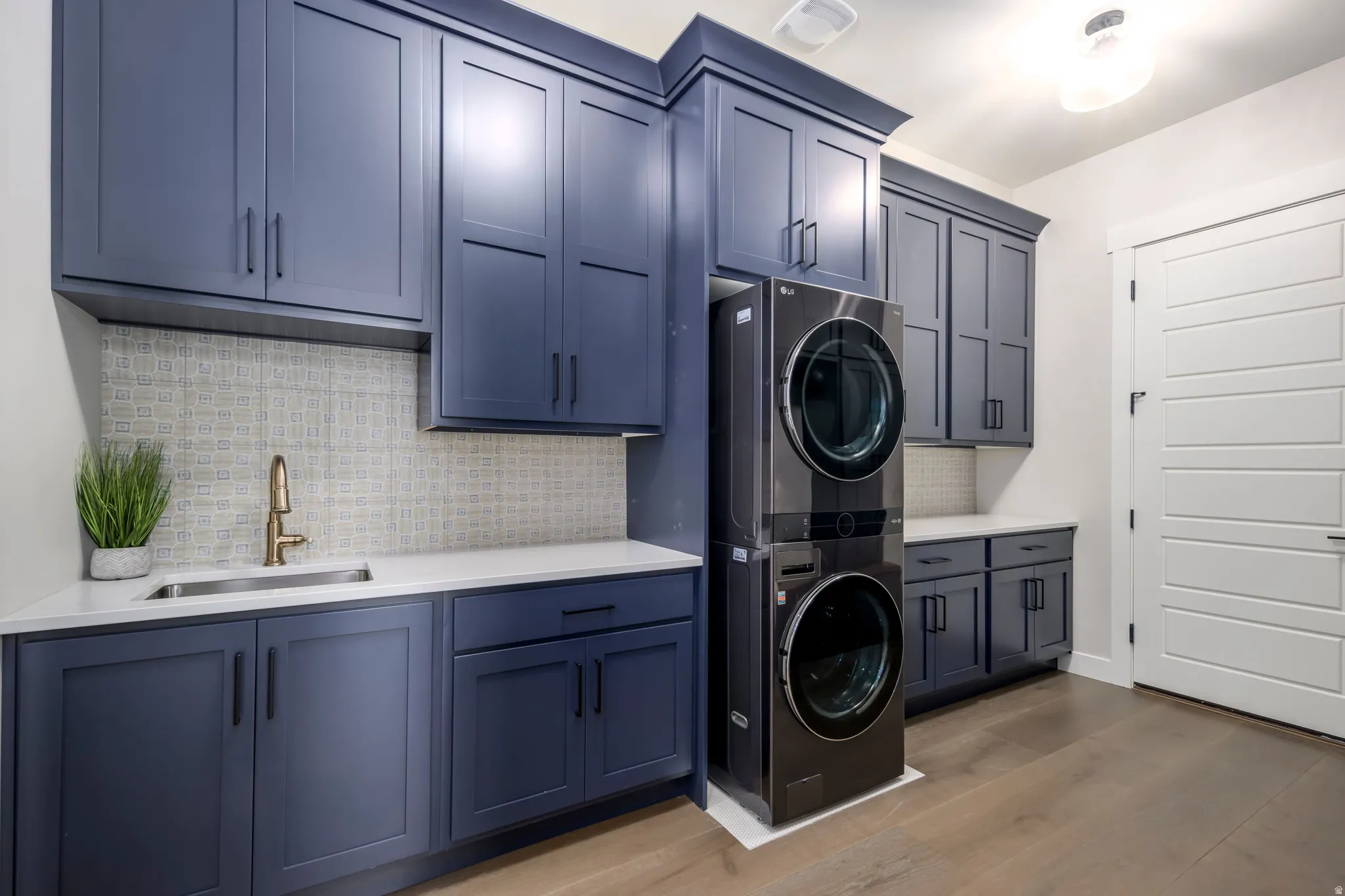 Laundry area featuring stacked washer/dryer