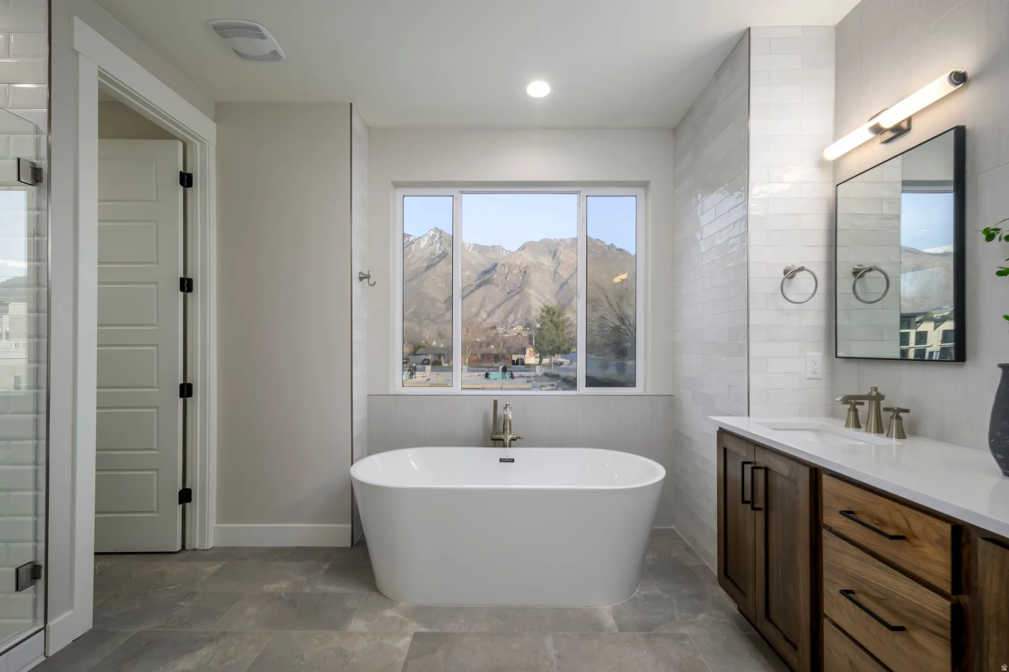 Spacious primary bath with soaking tub and shower