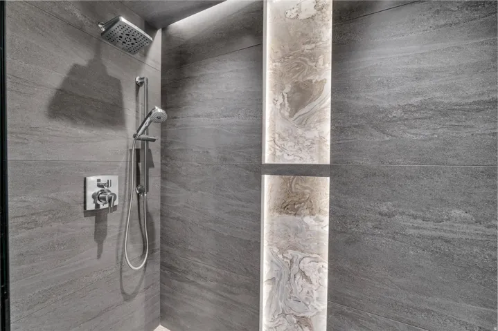 Bathroom featuring a tile shower