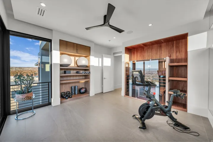 Exercise room with ceiling fan and recessed lighting