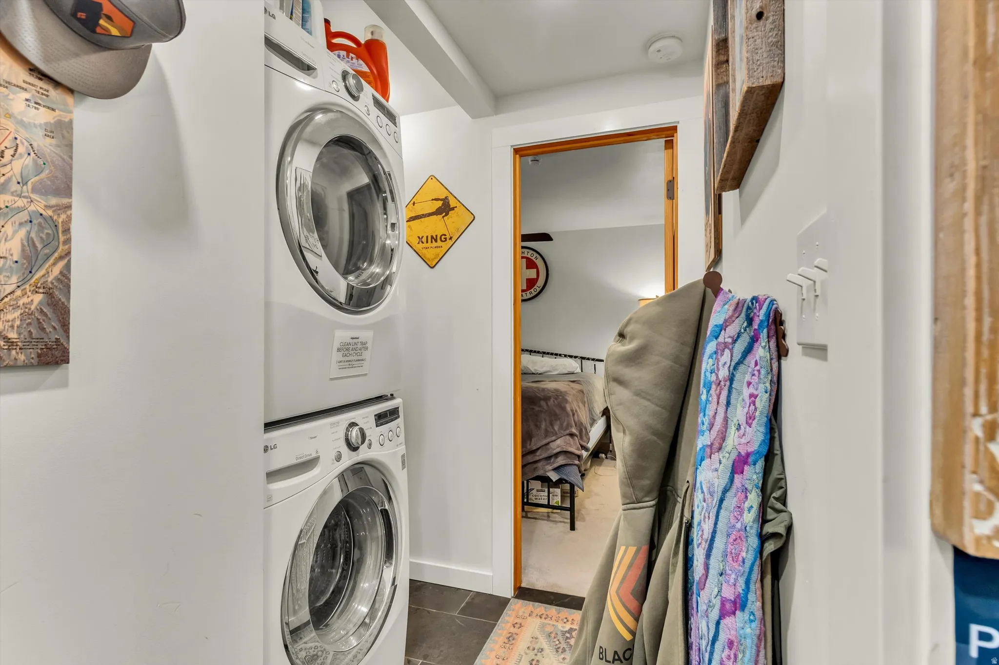 Stackable washer and dryer unit with slate-style flooring
