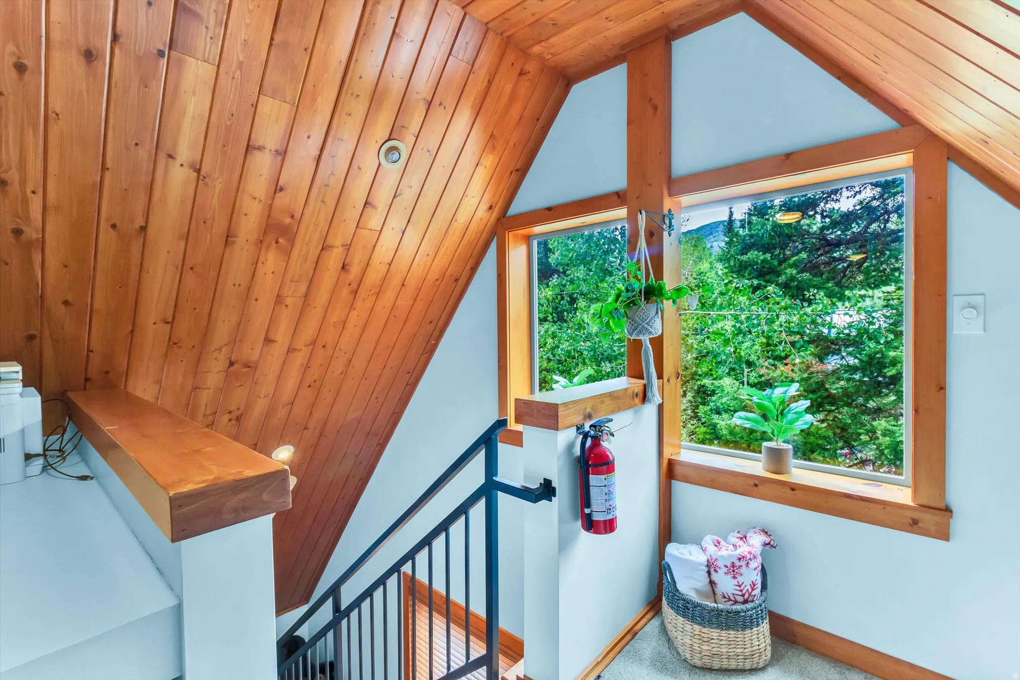 Vaulted wood-paneled ceiling with recessed lighting