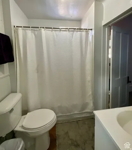 Bathroom featuring vanity and curtained shower