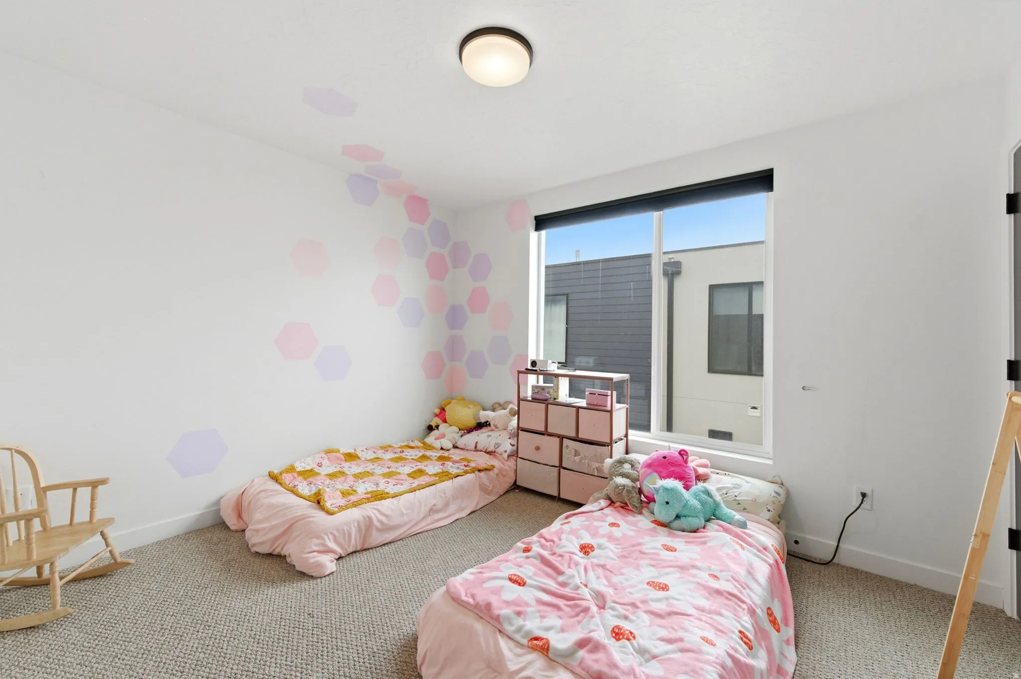 Bedroom featuring carpet flooring and baseboards