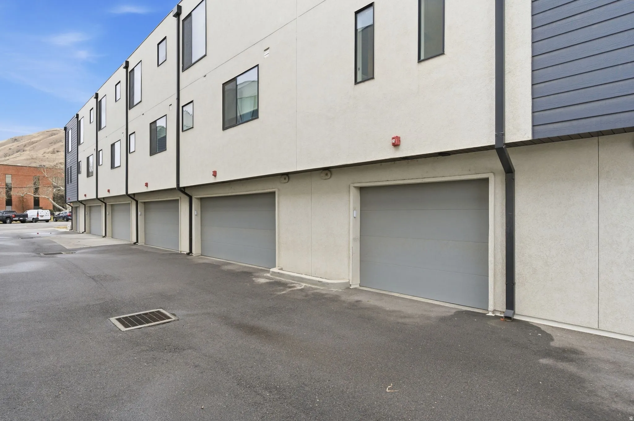 View of building exterior featuring an attached garage