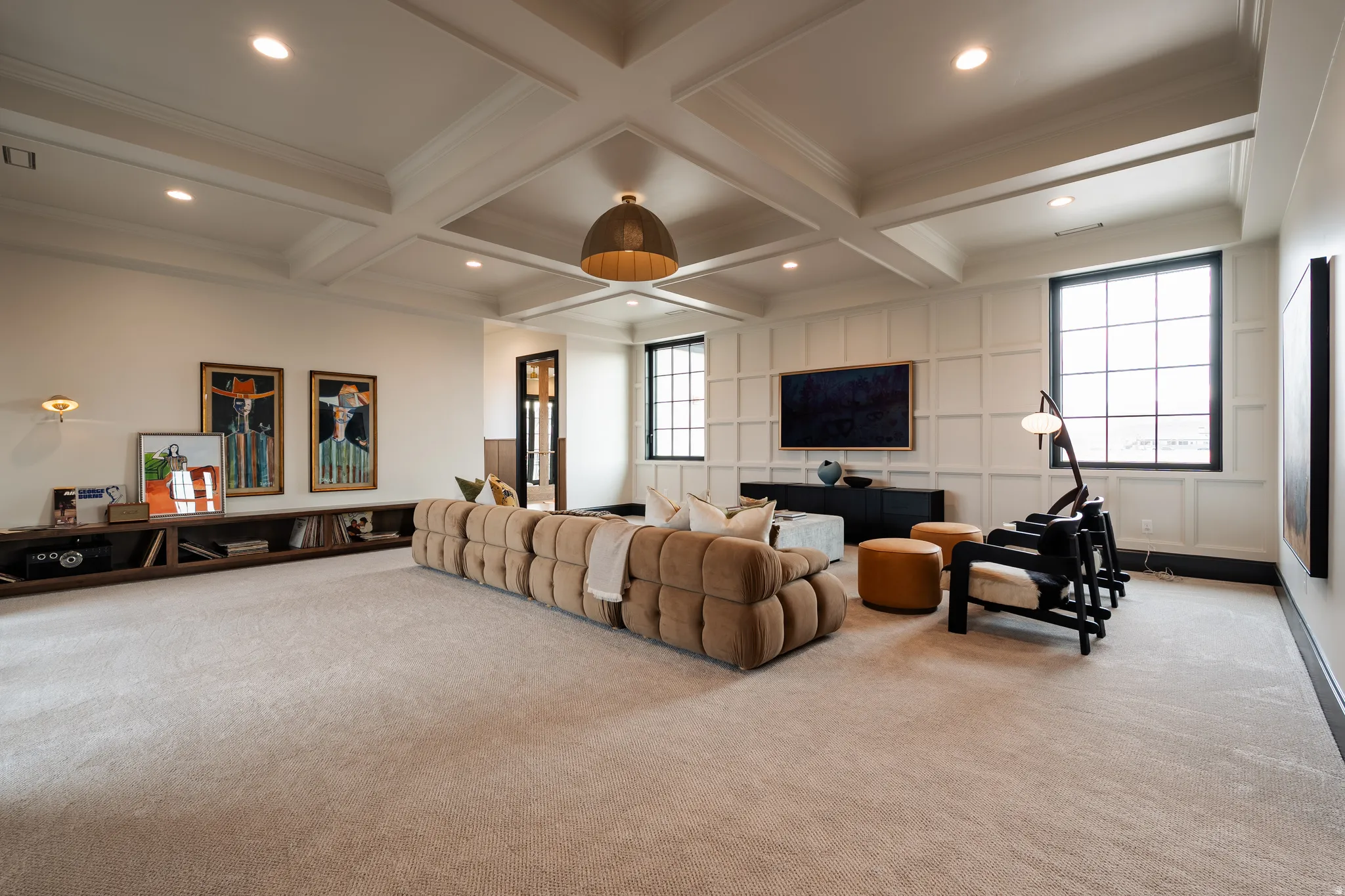Living room with a decorative wall, carpet, coffered ceiling, recessed lighting, and ornamental molding