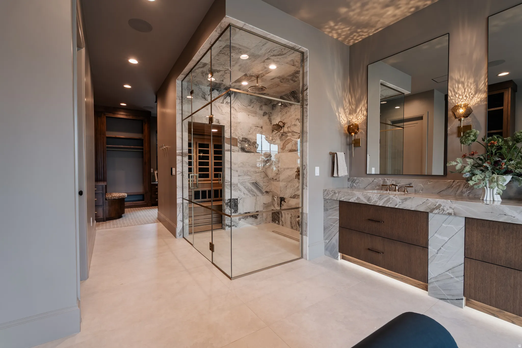 Full bath with vanity, a marble finish shower, and recessed lighting