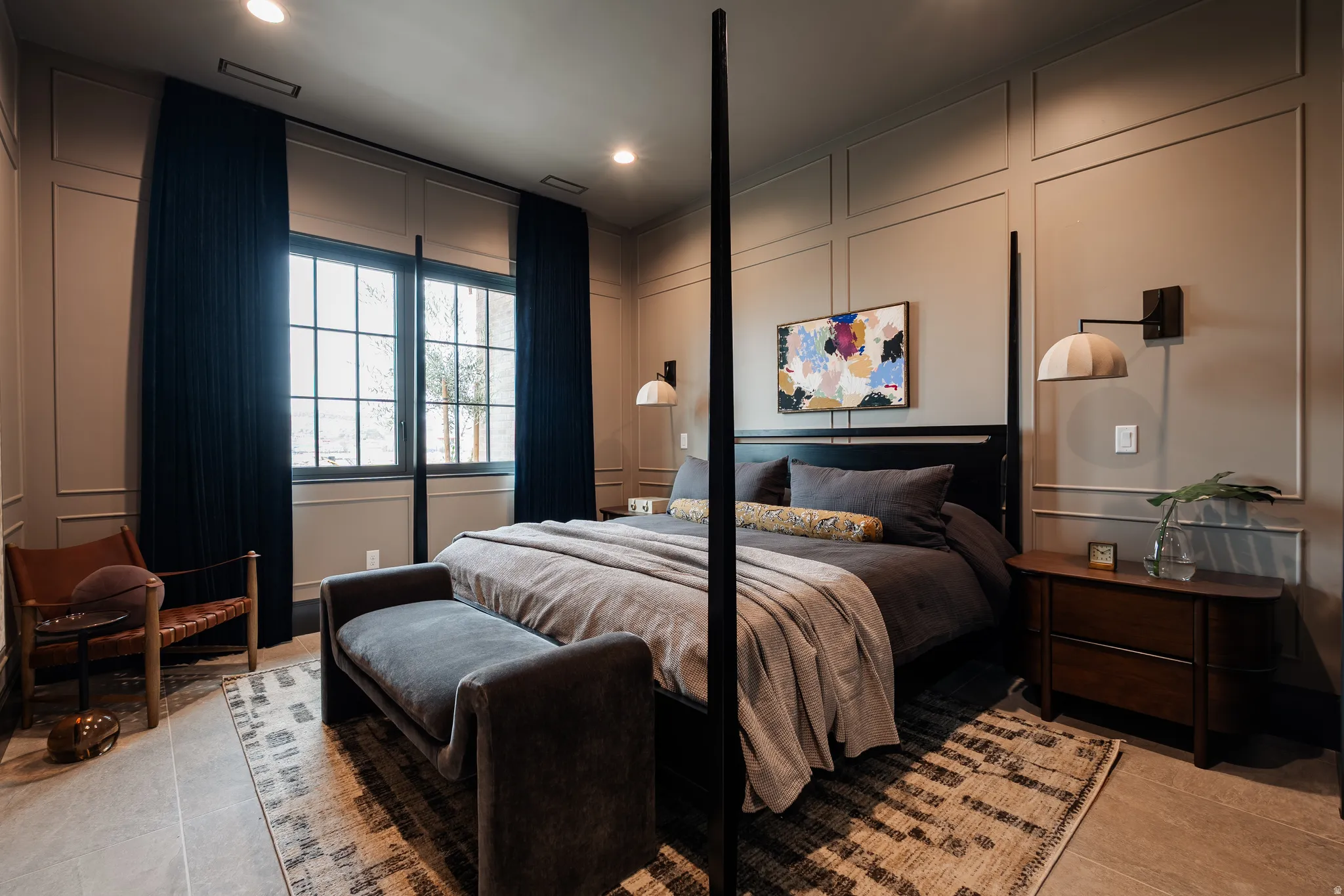 Bedroom with a decorative wall, recessed lighting, and light tile patterned floors