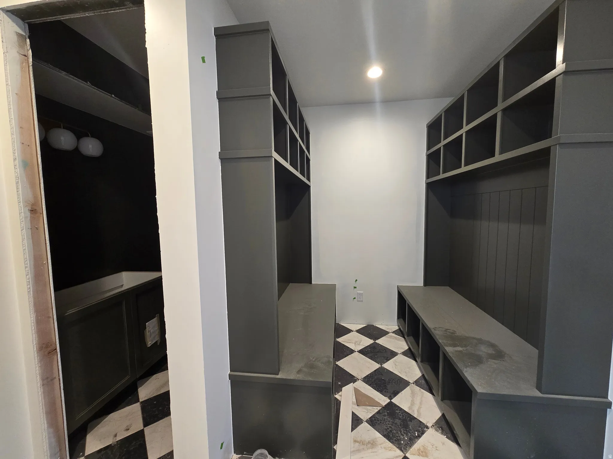 Mudroom featuring light floors and recessed lighting