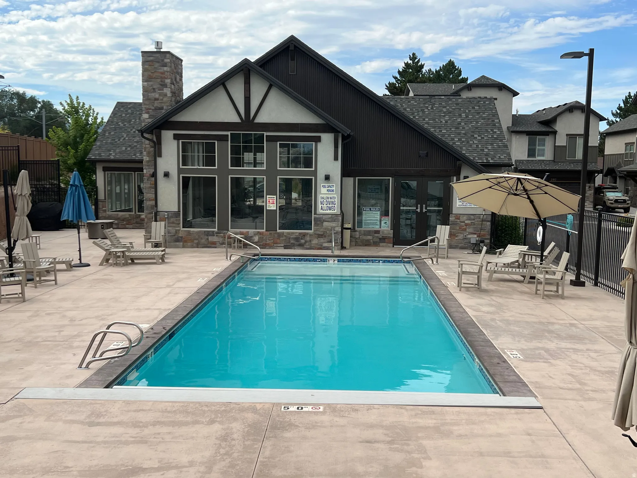 Community pool with a patio area