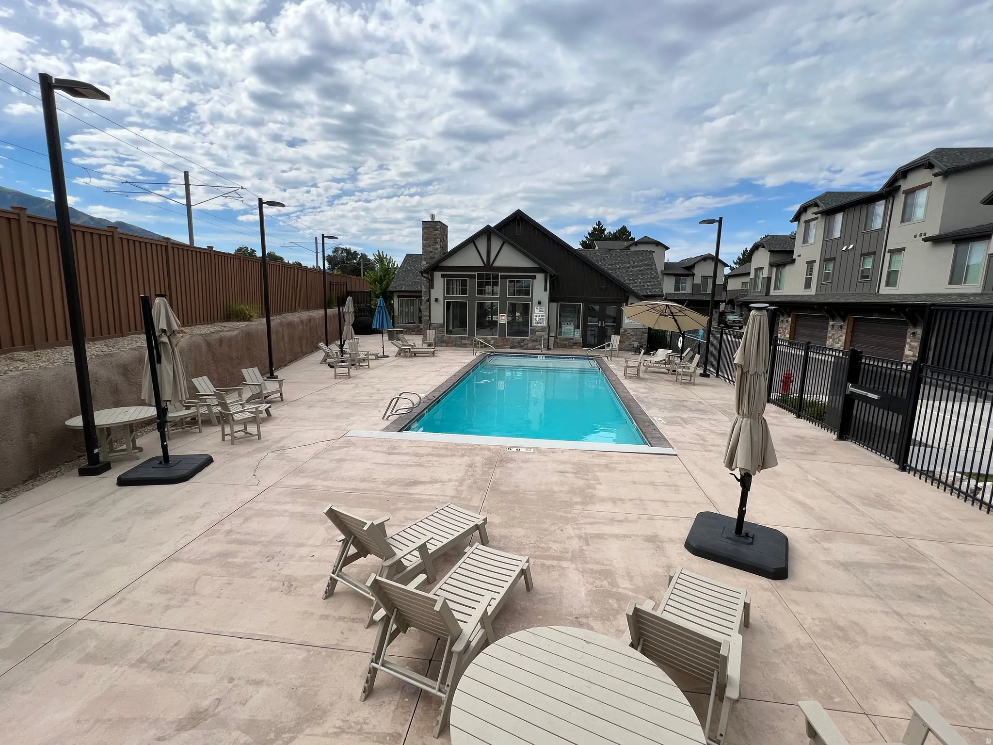 Community pool with a patio area