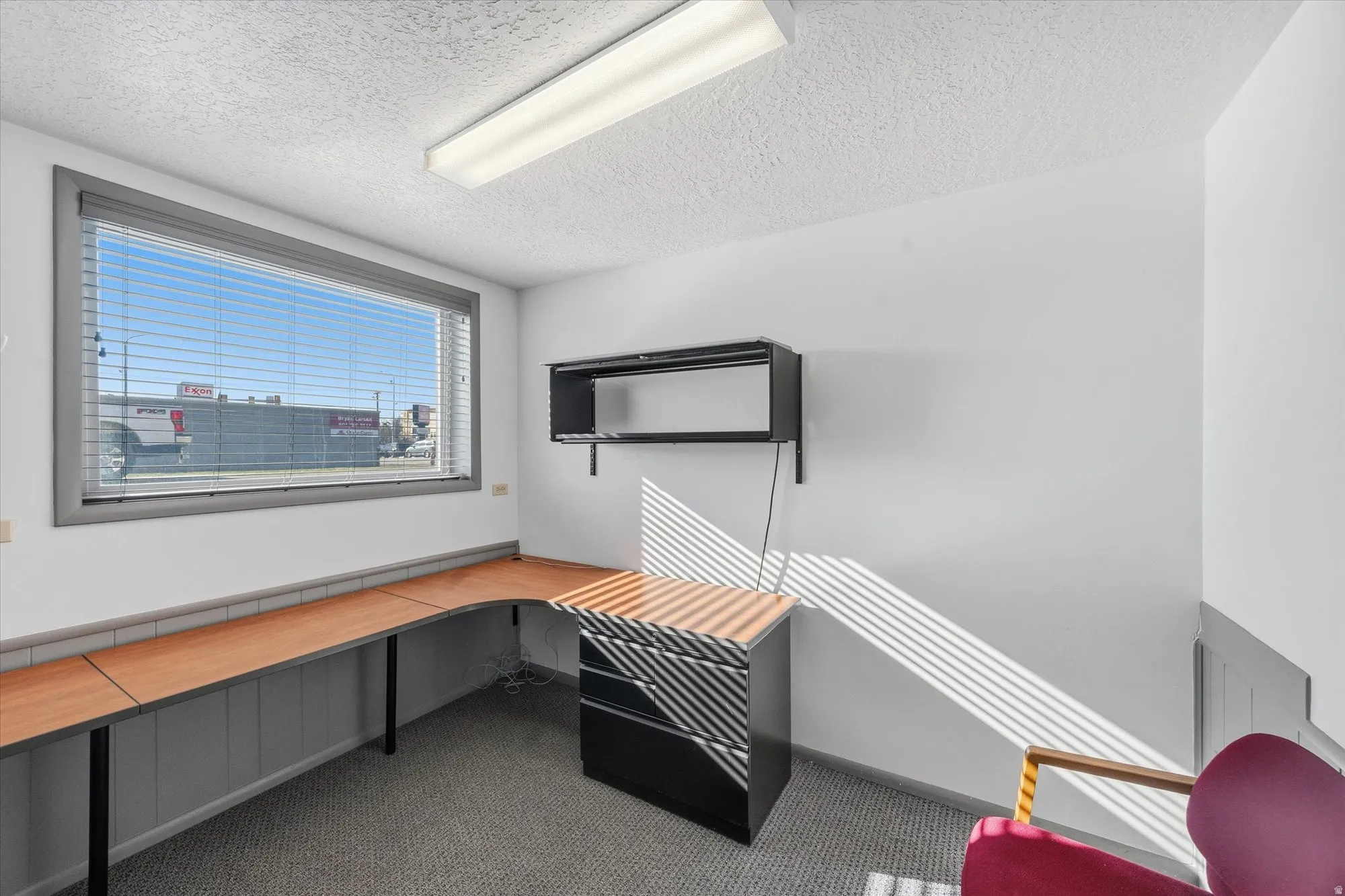 Unfurnished office featuring a textured ceiling