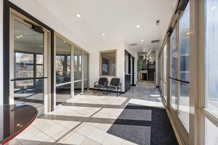 Sunroom / solarium with recessed lighting and baseboards