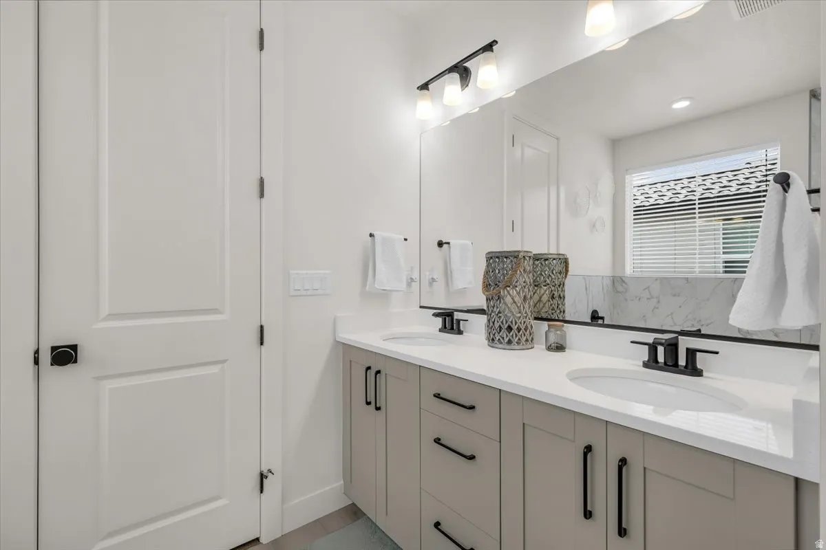 Full bathroom featuring double vanity