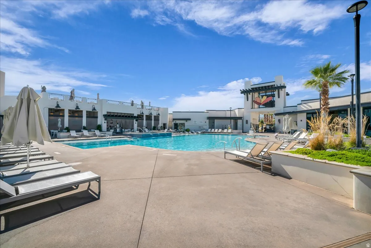 Community pool with a patio area