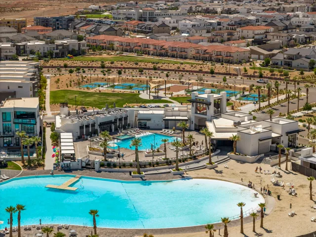 Community pool with a residential view and a patio area
