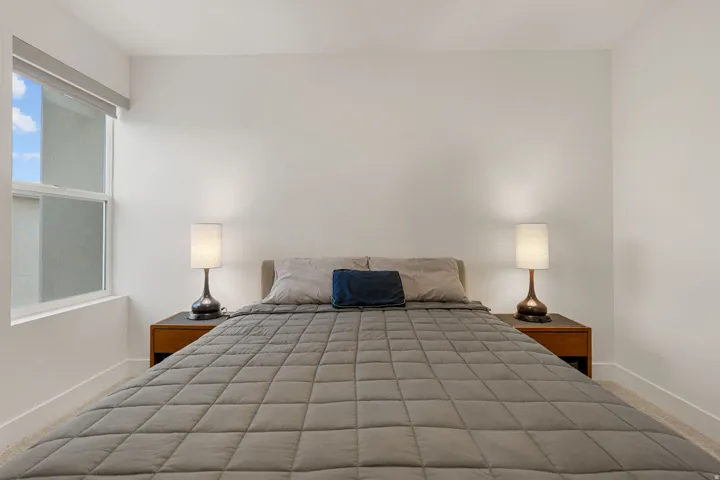 Unfurnished bedroom featuring baseboards and carpet