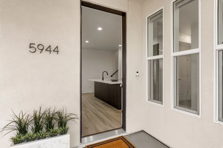 View of exterior entry featuring stucco siding