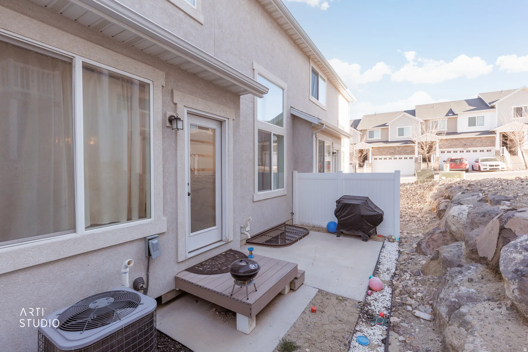 View of patio / terrace with a grill and a residential view