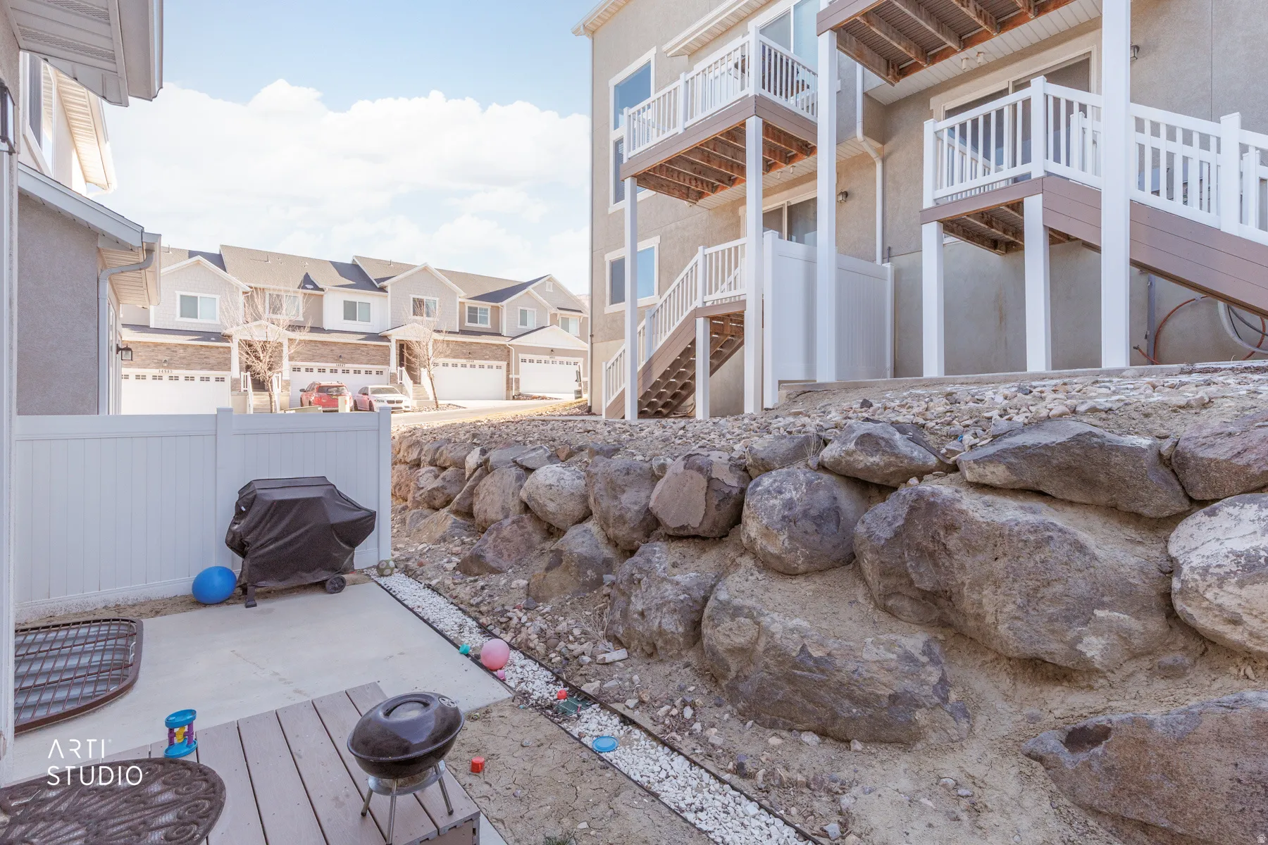 View of patio / terrace with a residential view, a wooden deck, and a grill