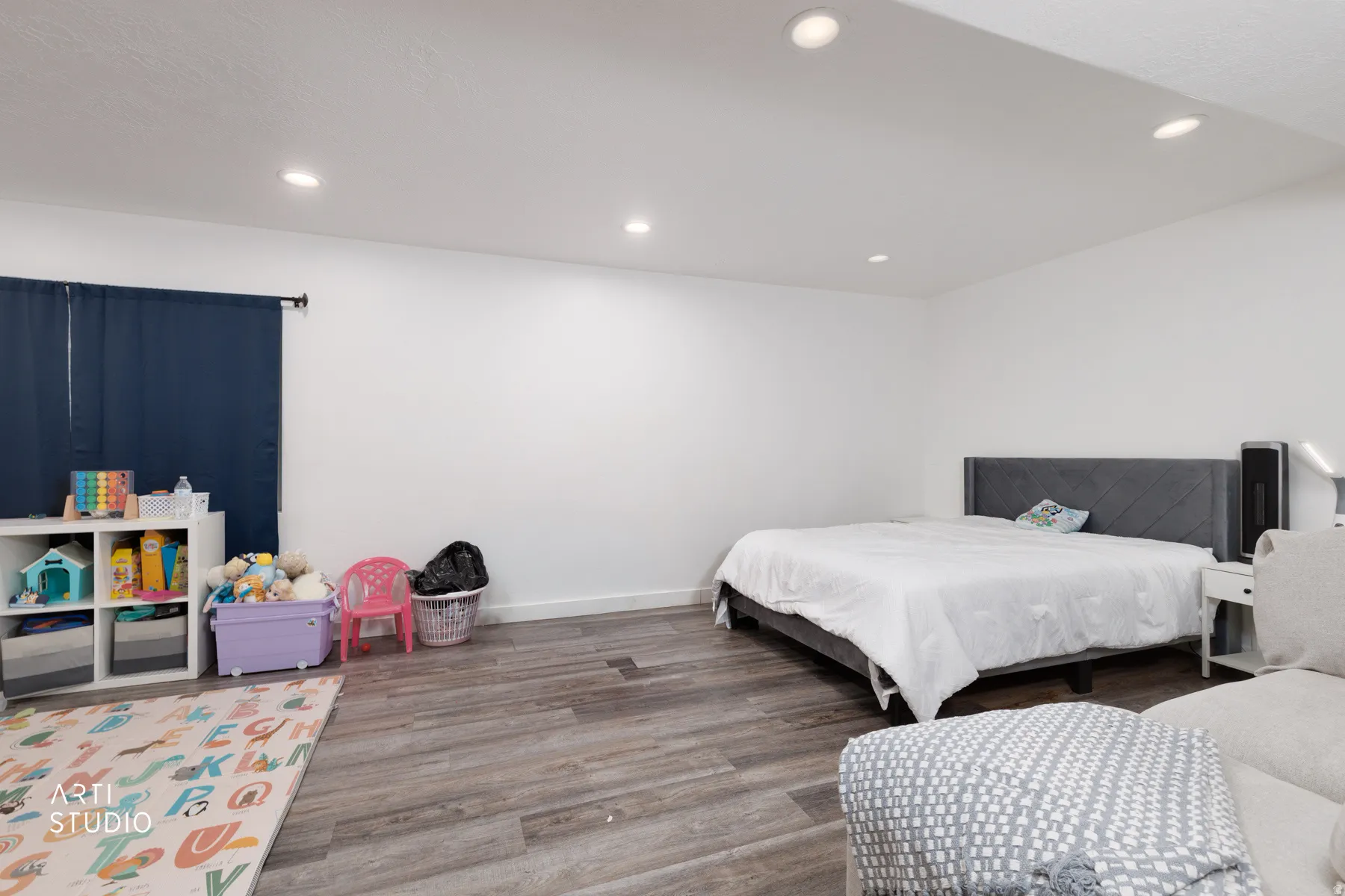 Bedroom featuring wood finished floors and recessed lighting