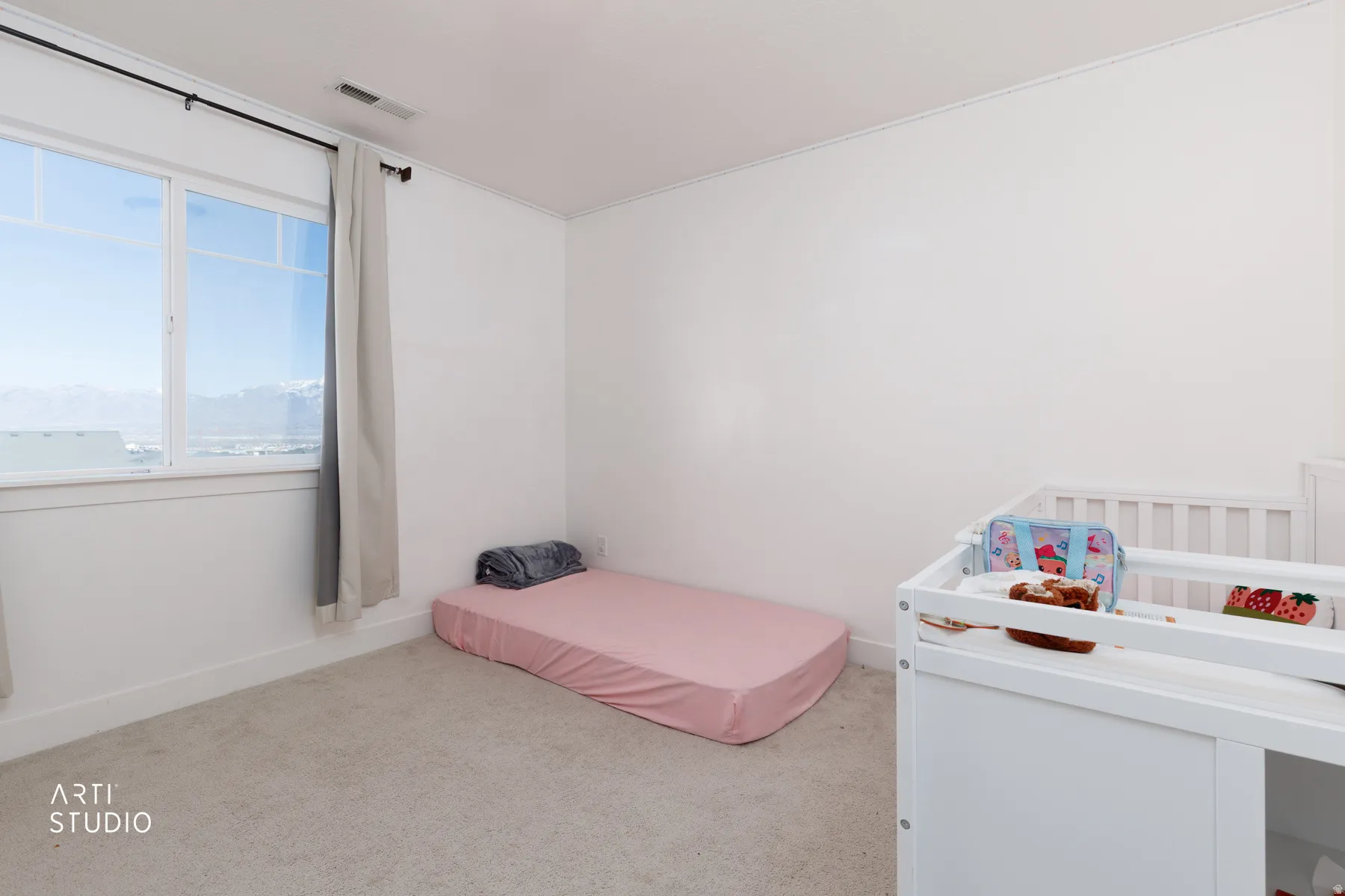 Carpeted bedroom featuring baseboards
