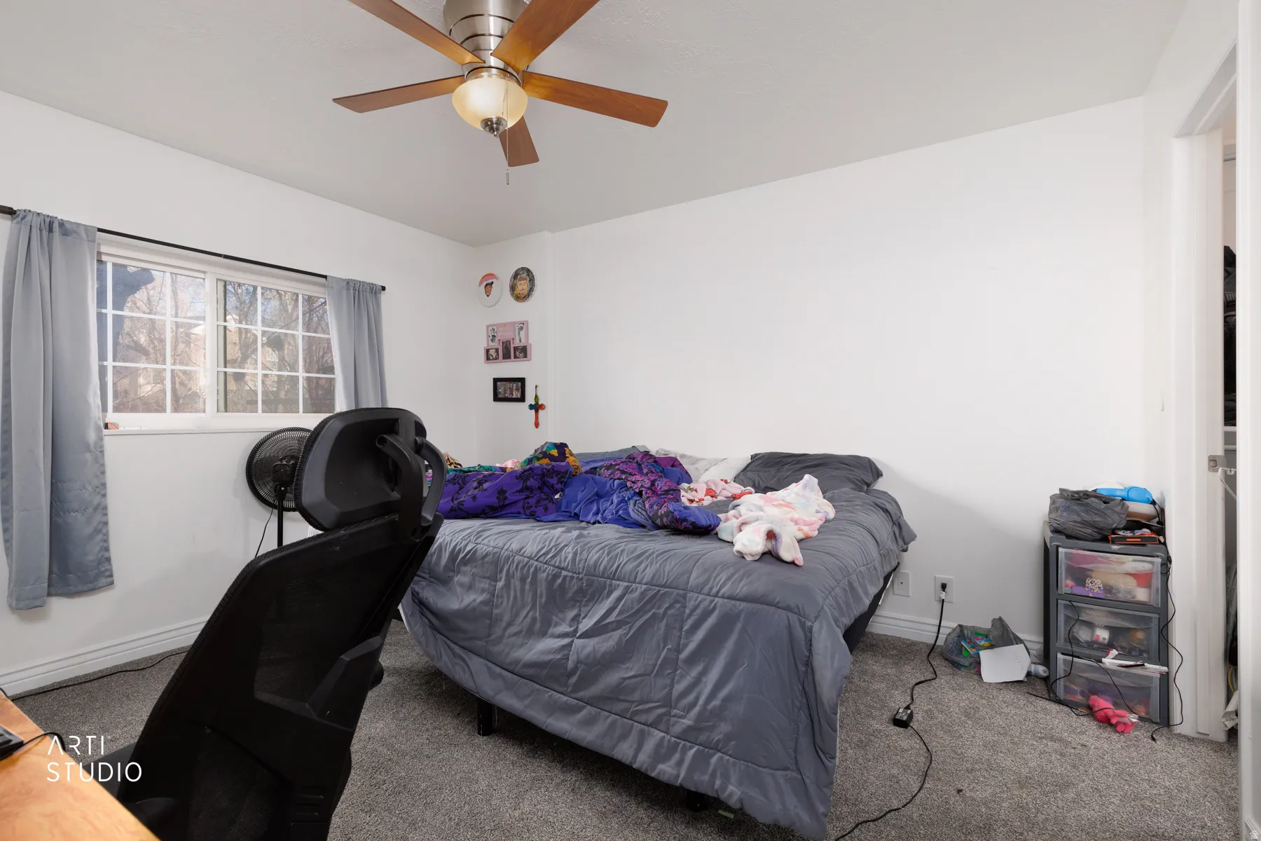 Bedroom featuring carpet flooring and ceiling fan