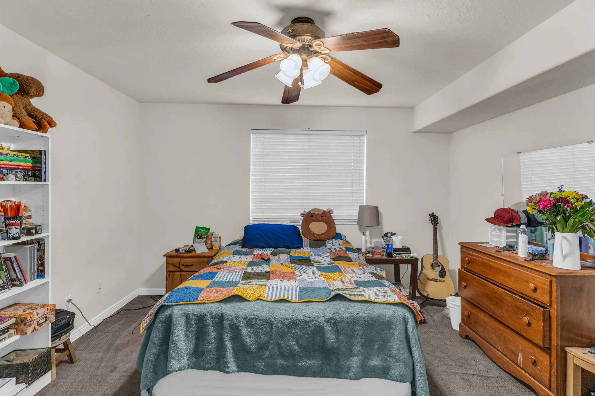 Bedroom with carpet floors and ceiling fan