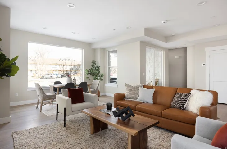 Living area with wood finished floors and recessed lighting