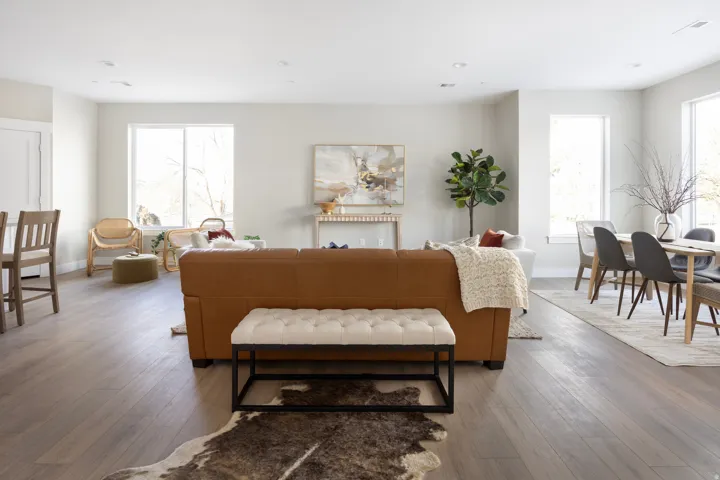 Living room with hardwood / wood-style flooring and healthy amount of natural light