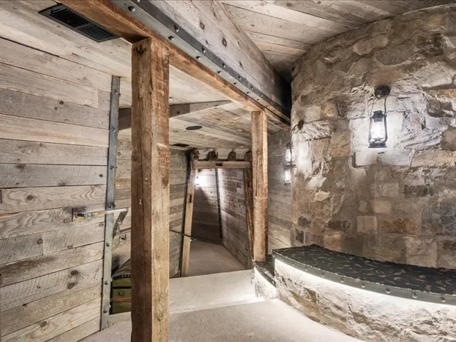 Hall with wood walls and concrete flooring
