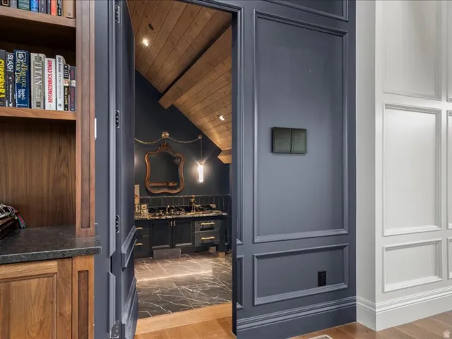 Detailed view of wood finished floors, recessed lighting, and wood ceiling