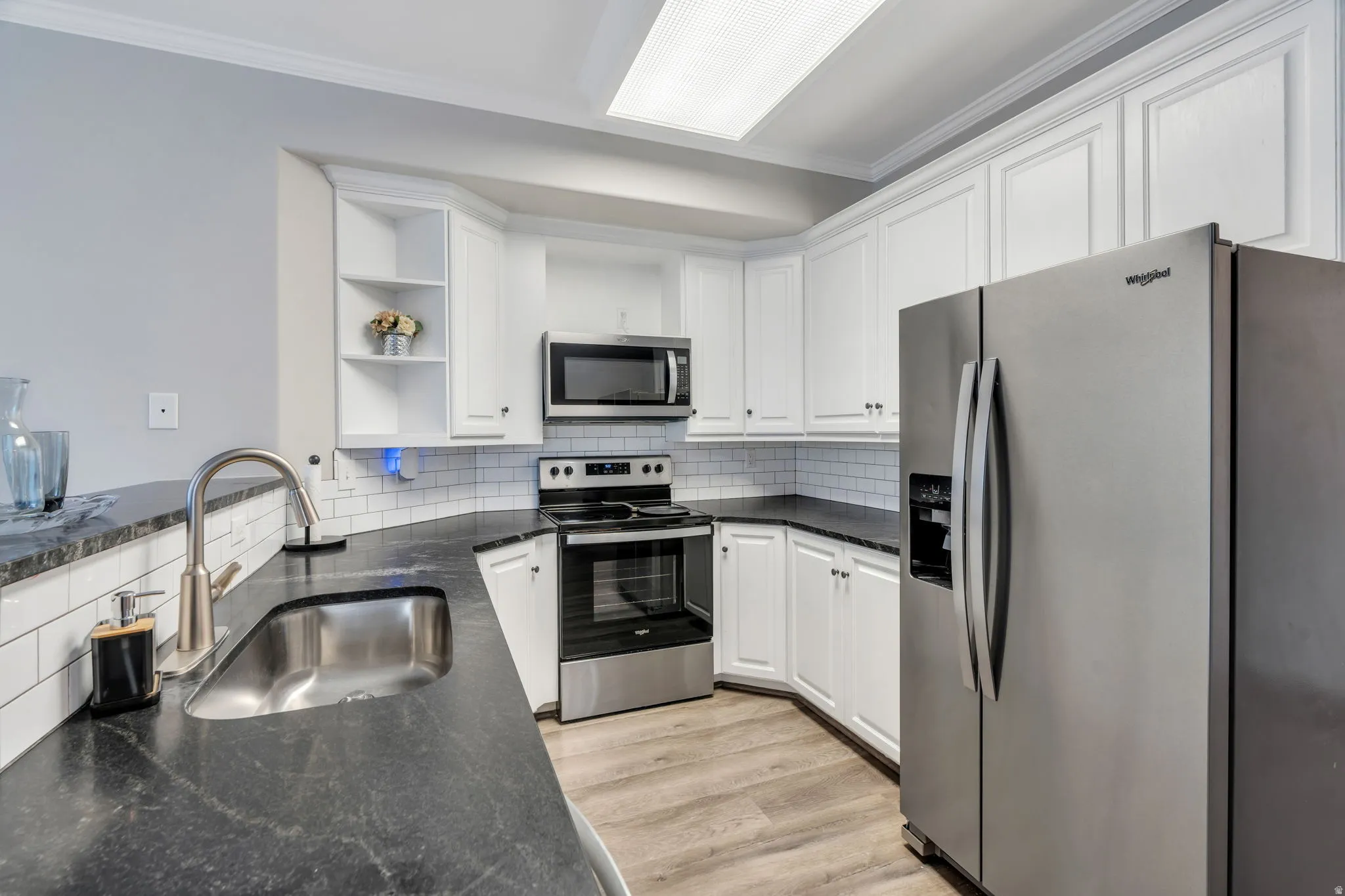 Classic white kitchen with stainless steel appliances