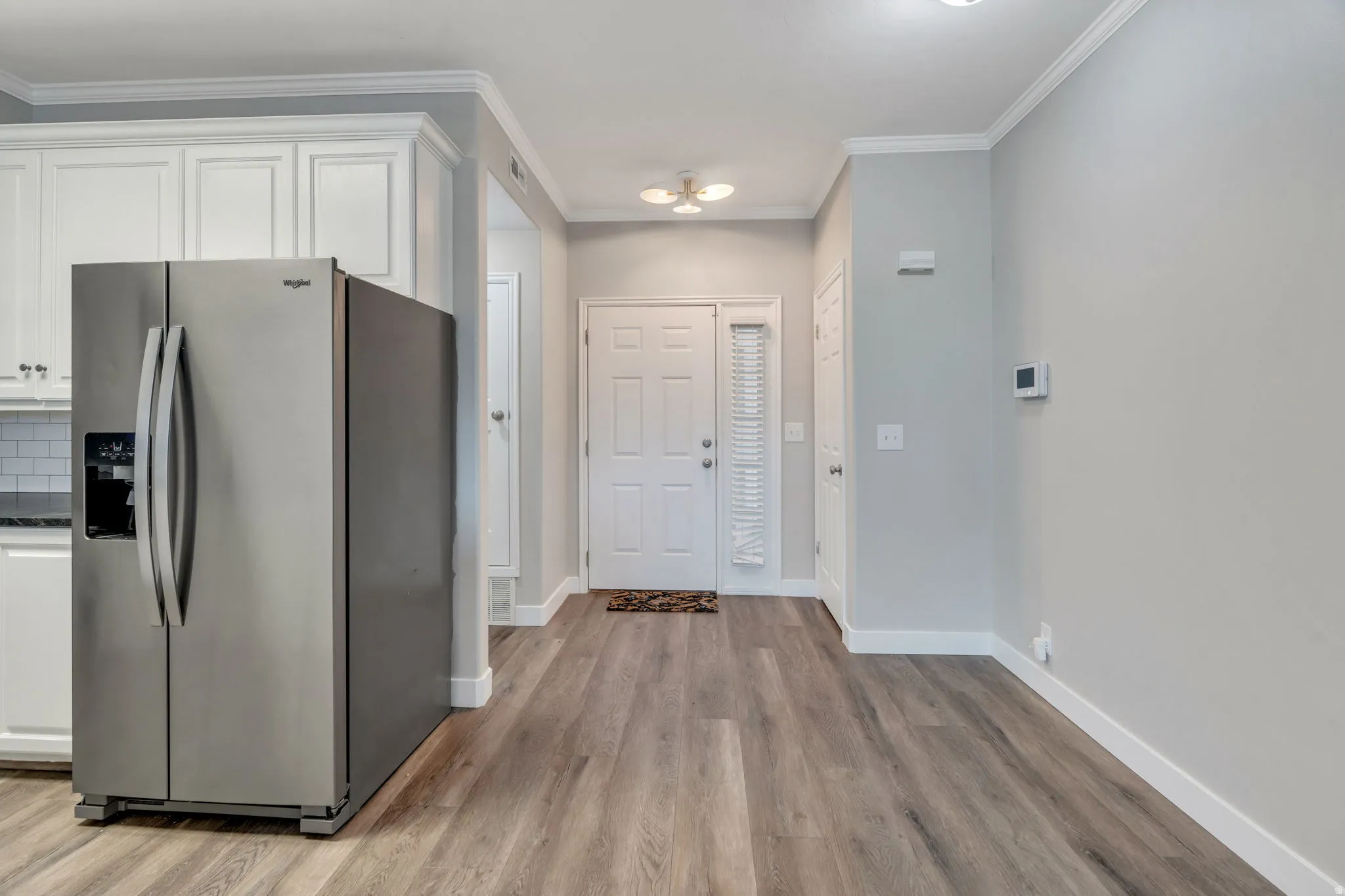 Entryway has a coat closet