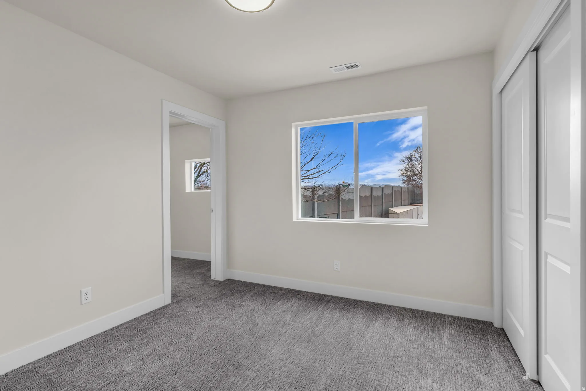 Unfurnished bedroom with a closet and carpet floors