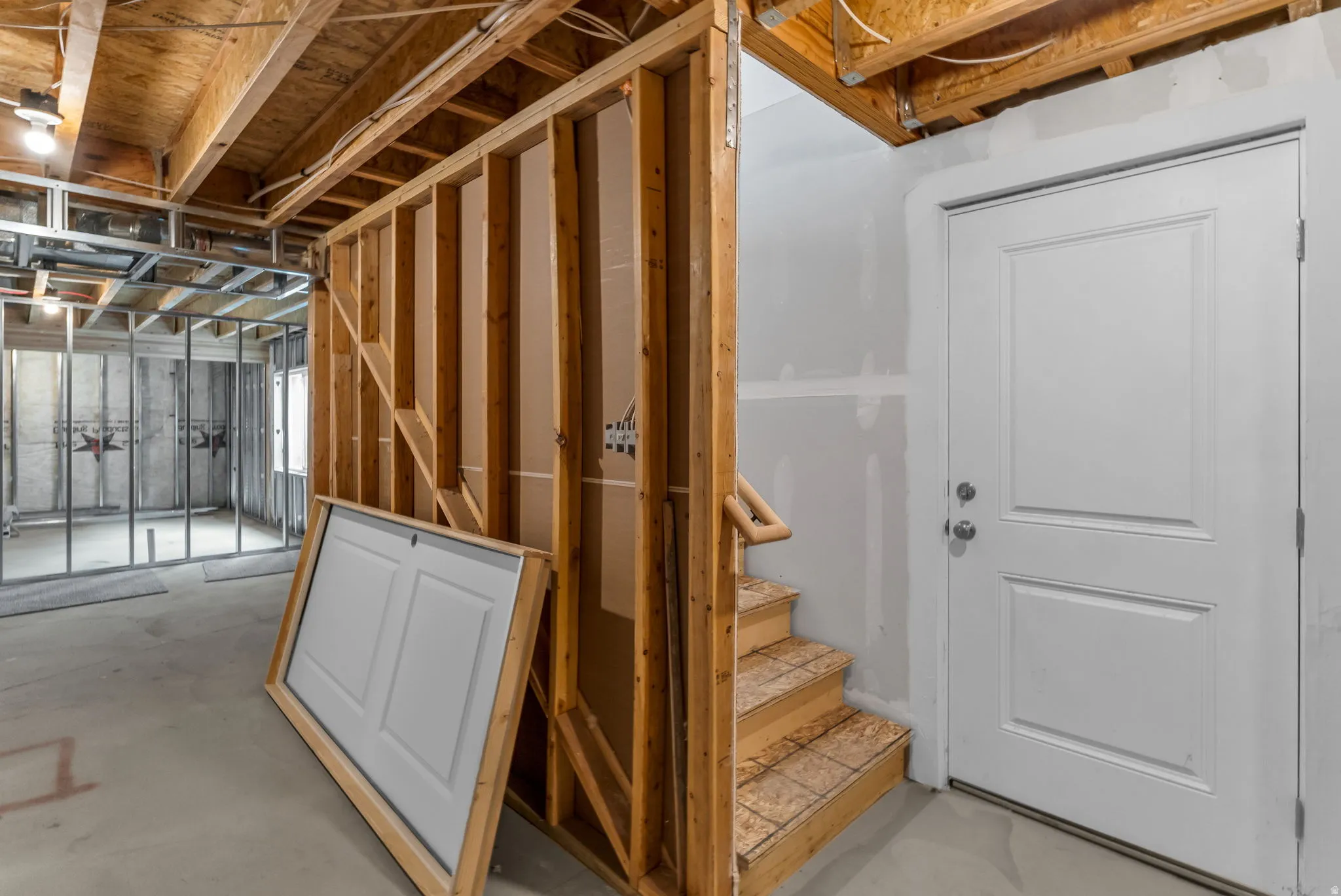 Basement featuring stairs