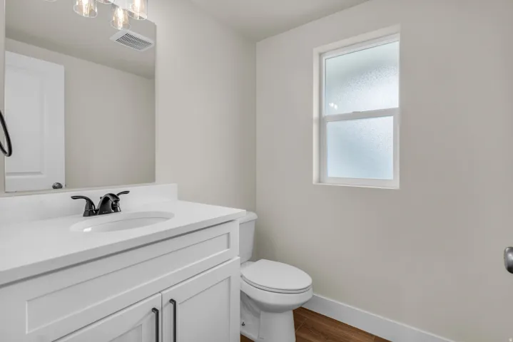 Bathroom with vanity and wood tiled floors