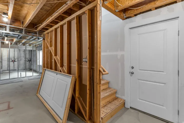 Basement featuring stairs