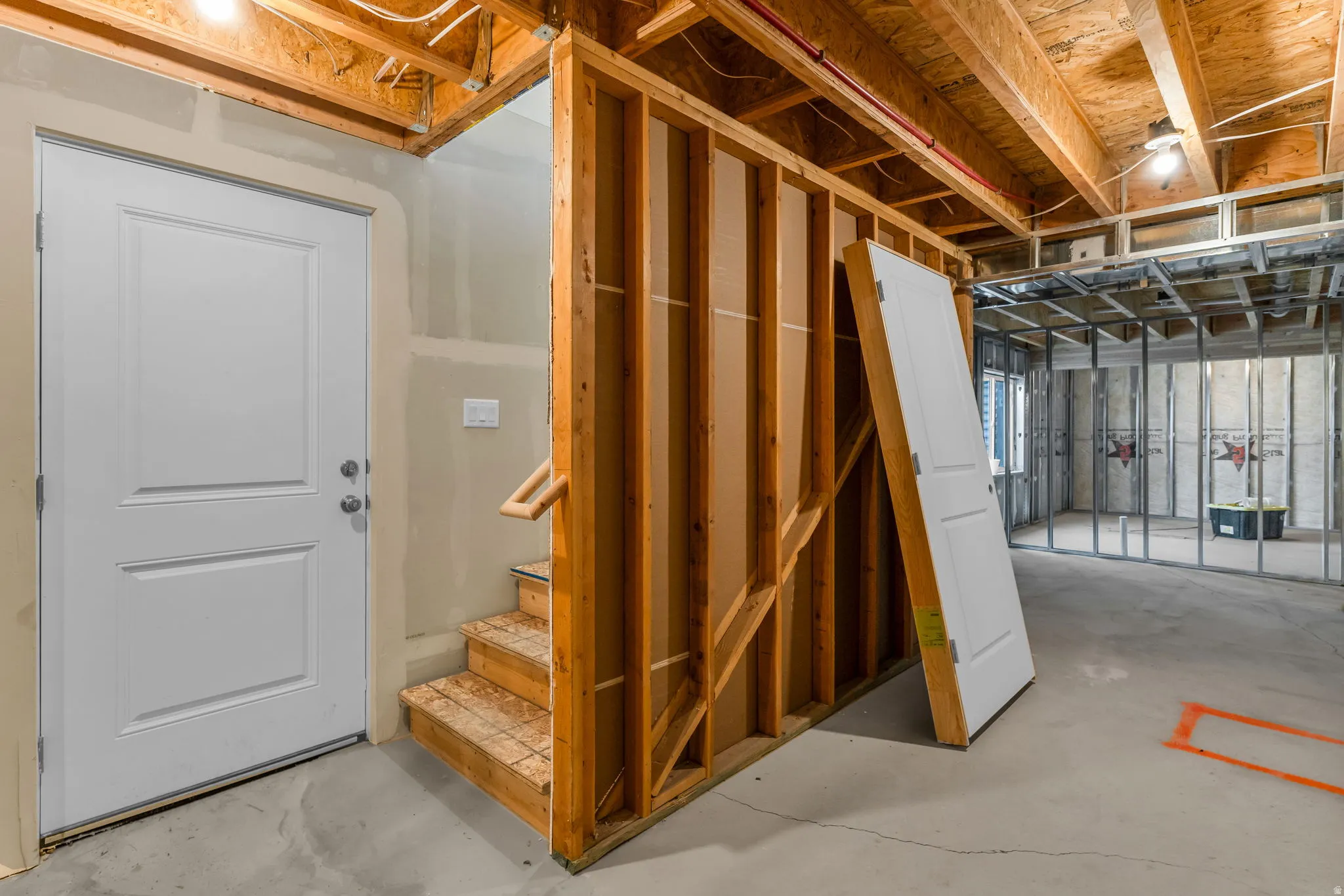 Unfinished below grade area with stairs